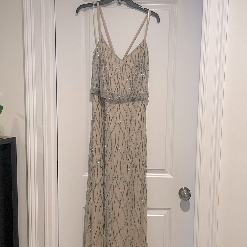 Floor length evening gown. Nude with silver beading.